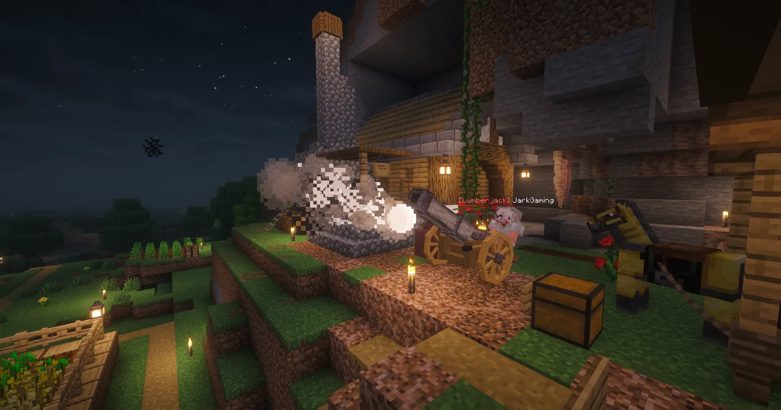 A cannon firing at night beside a stone tower